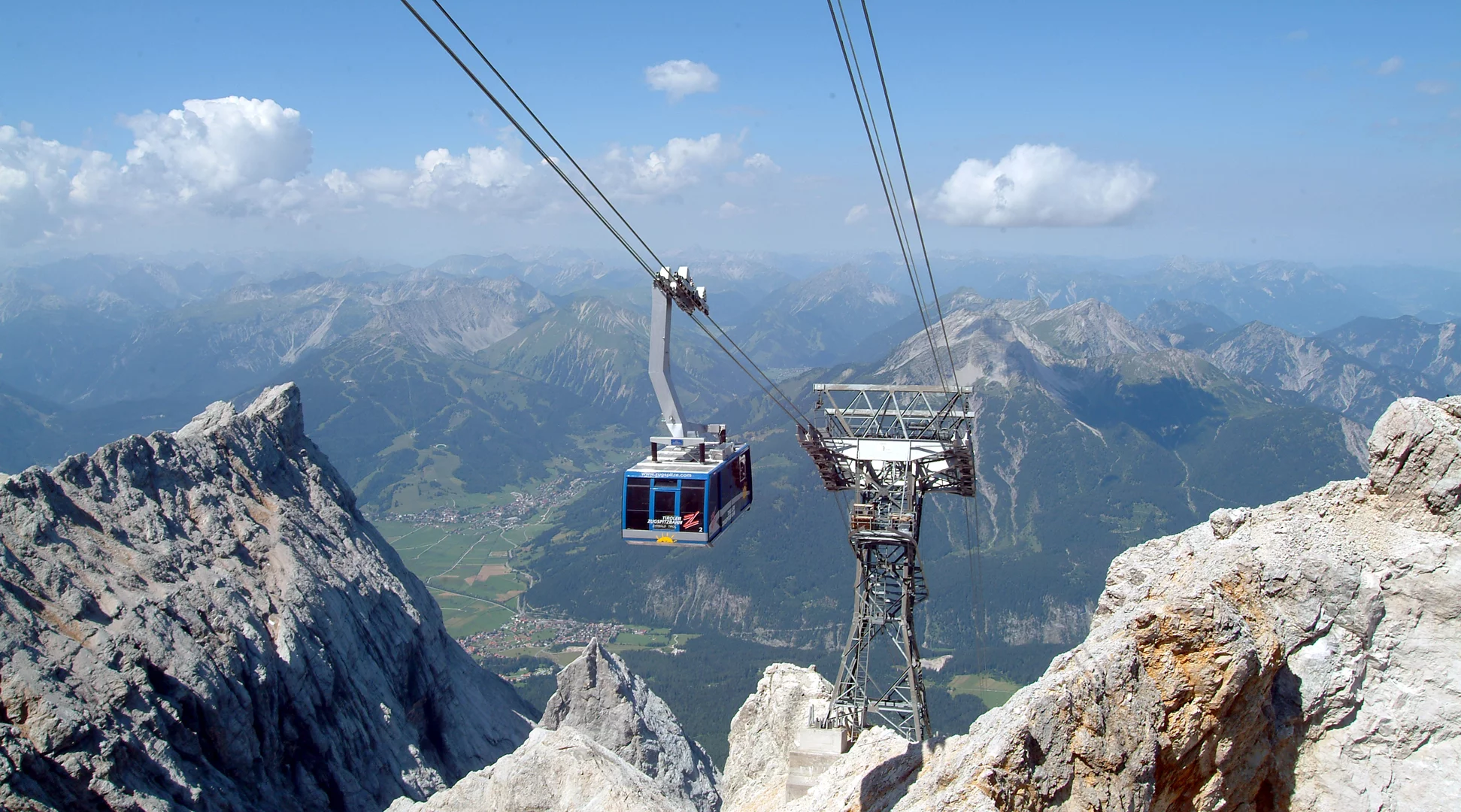 Tiroler Zugspitzbahn A large gondola lift going to the top of the Zugspitze in the summer.