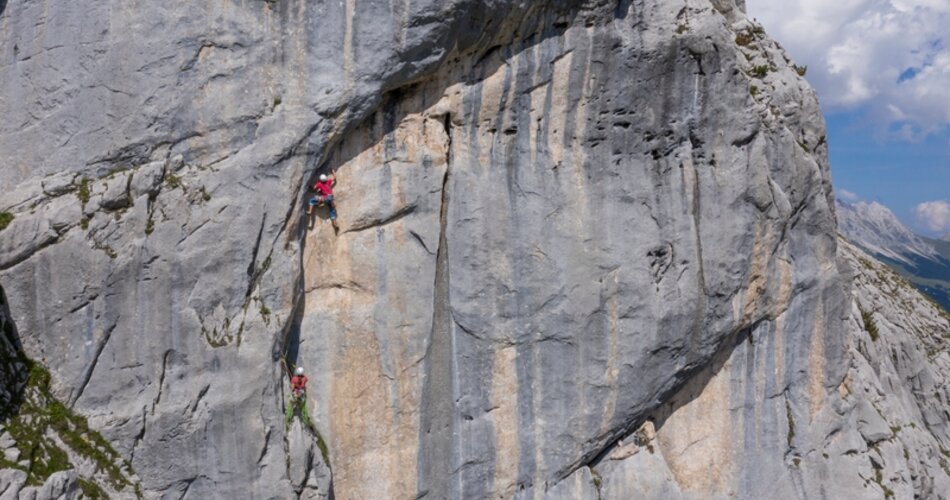 Two climbers on a rock face