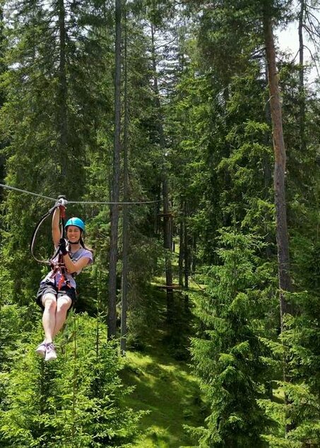 Woman at Flying Fox in the green forest | © TZA