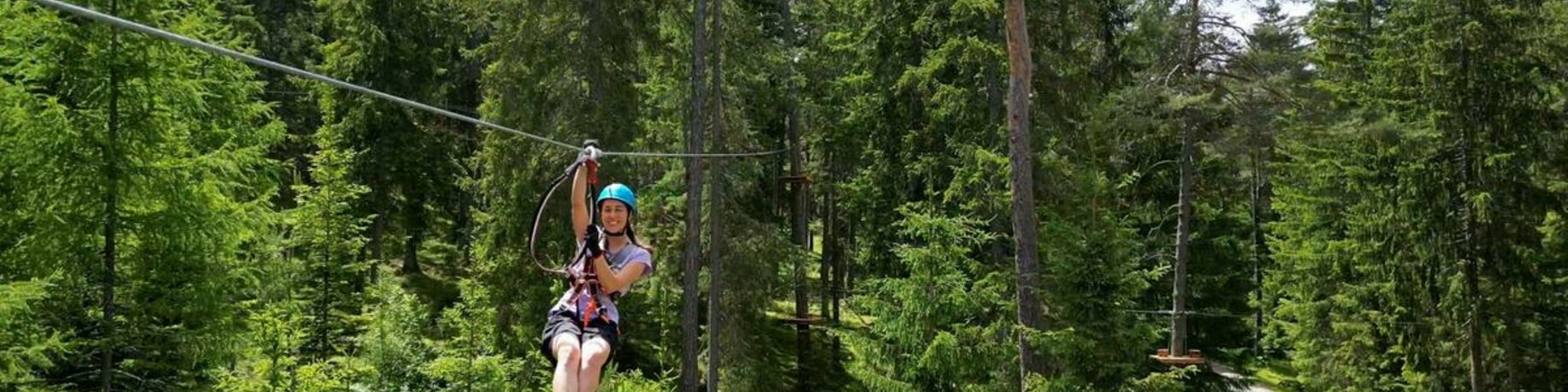 Woman at Flying Fox in the green forest | © TZA