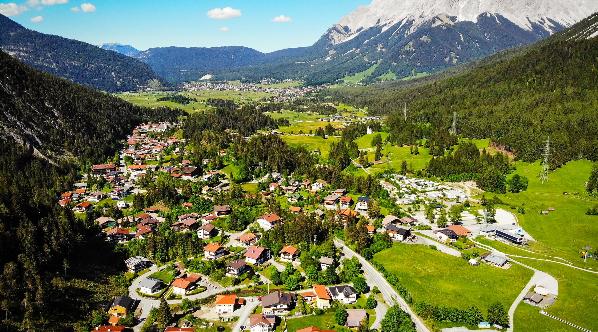 The village of Biberwier, with the Zugspitze in the background | © Tiroler Zugspitz Arena/ Matej Kurzweil