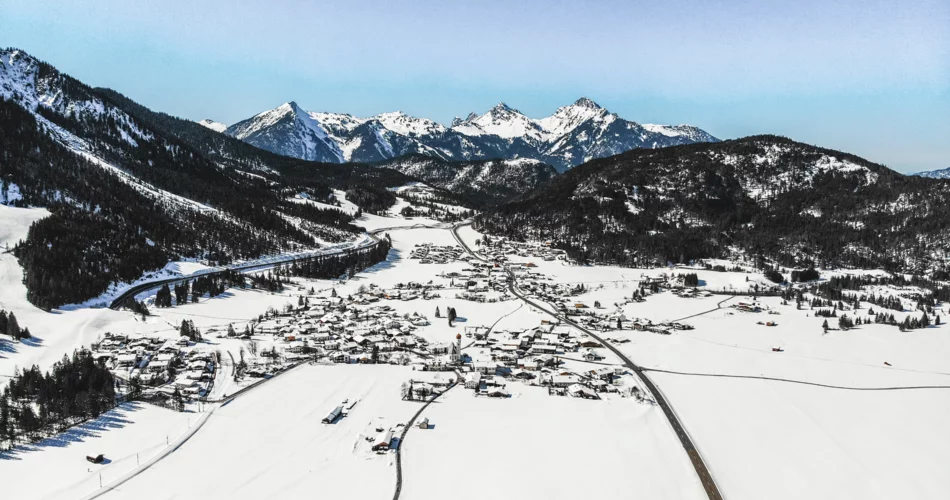 A drone shot of the village of Heiterwang am See in winter