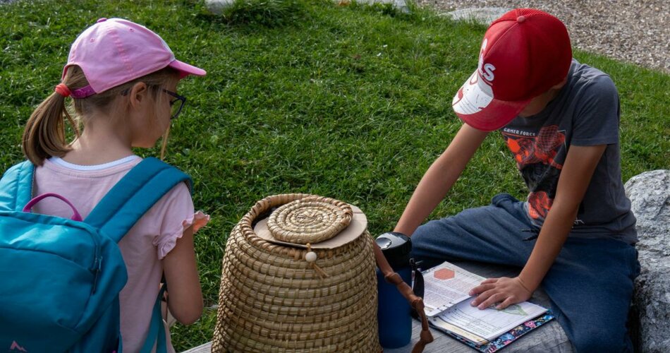 A girl and a boy solve a puzzle of the Escape Trail