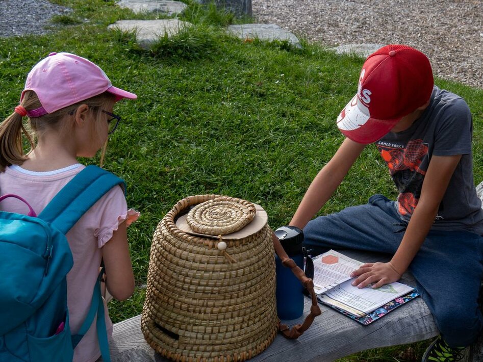 A girl and a boy solve a puzzle of the Escape Trail