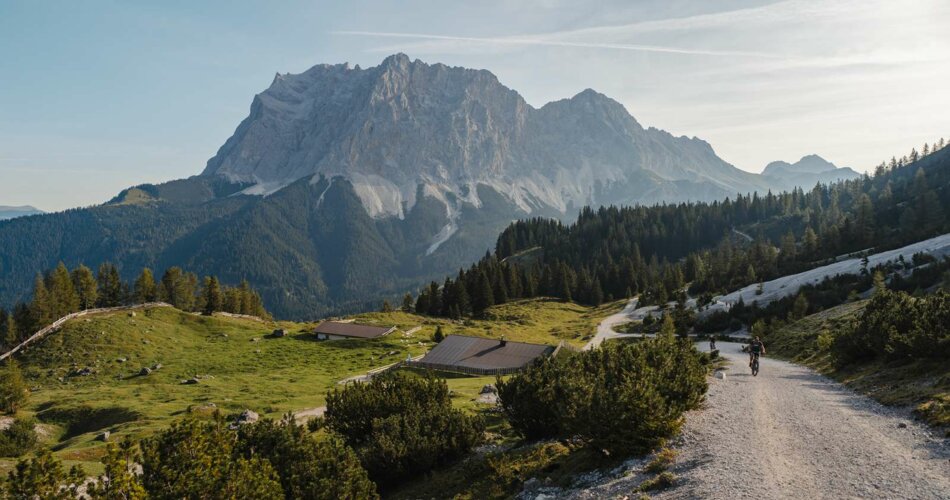 The Zugspitze, alpine meadows and a hut | © Tiroler Zugspitz Arena/ Sam Oetiker