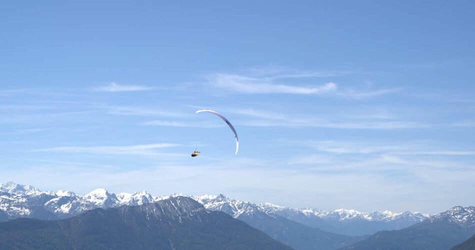 A paraglider is flying