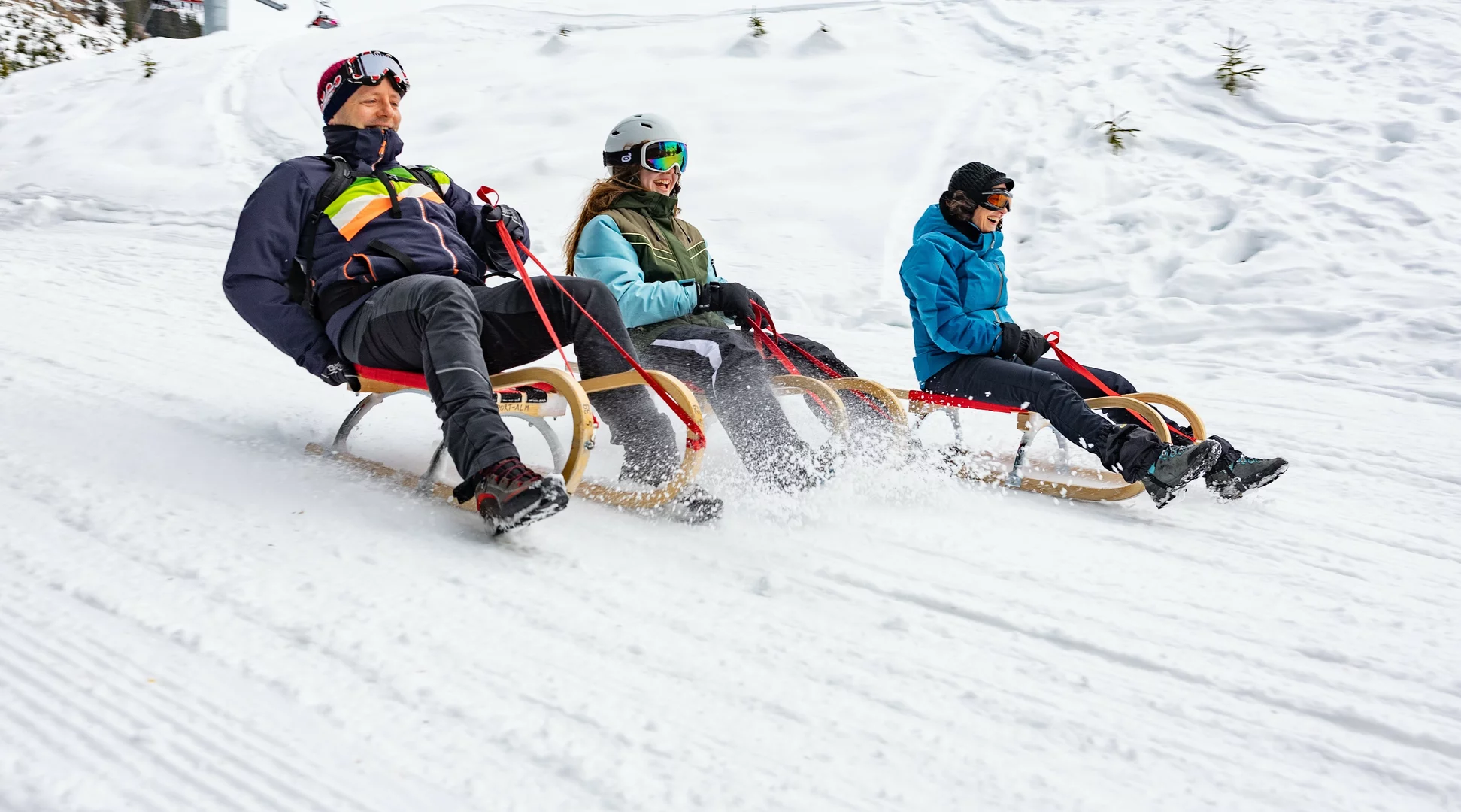 Eine Familie beim Rodeln | © Tiroler Zugspitz Arena/ Valentin Schennach