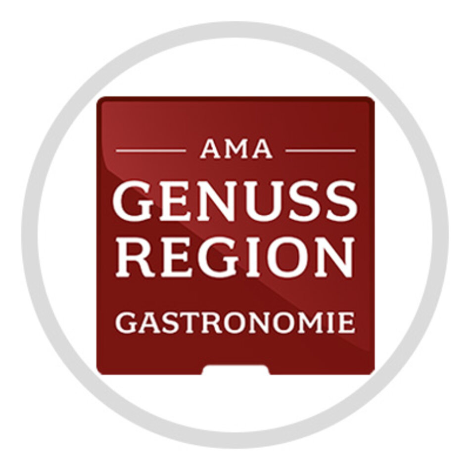 A red logo with the white inscription AMA Genuss Region | © AMA Marketing