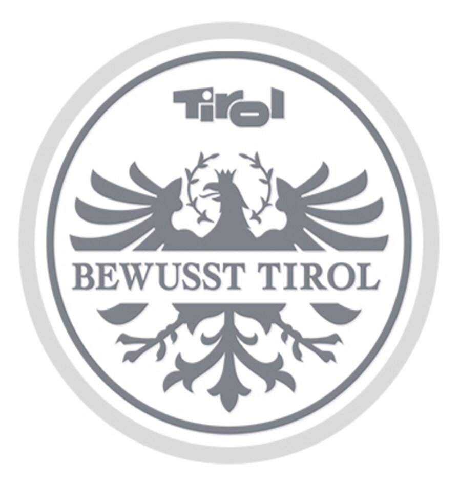 Gray eagle and gray lettering Bewusst Tirol (Consciously Tyrol) | © Agrarmarketing Tirol GmbH